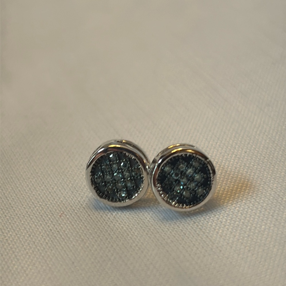 10kt white gold 
.10ctw 
Irradiated blue diamond earrings
